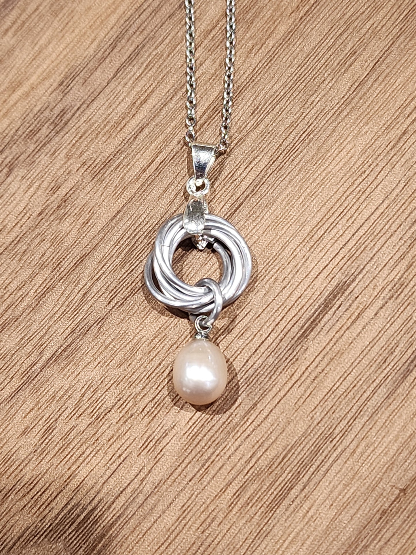 Silver Love Knot Necklace with Freshwater Pearl – A Timeless Symbol of Love and Grace