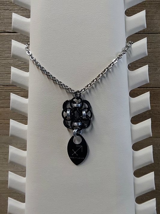 Helm Flower Onyx (Black) and Platinum (Silver) Zodiac Scale Pendant - Sagitarius